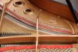Pre-Owned Yamaha GB1K baby grand piano, view of strings and plate
